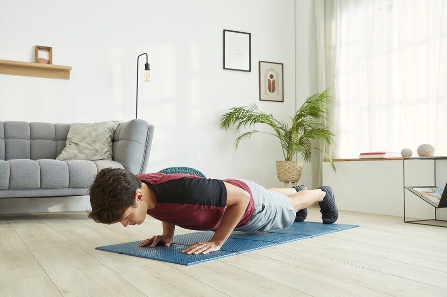 Stand in the plank to work the muscles of the press and back