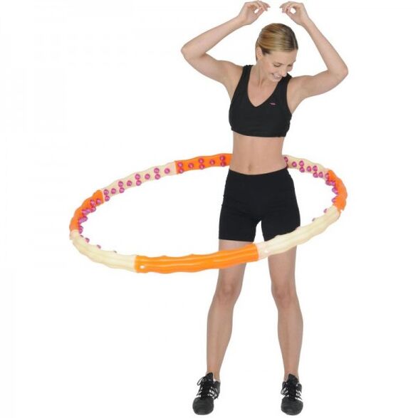 The girl twists the hoop